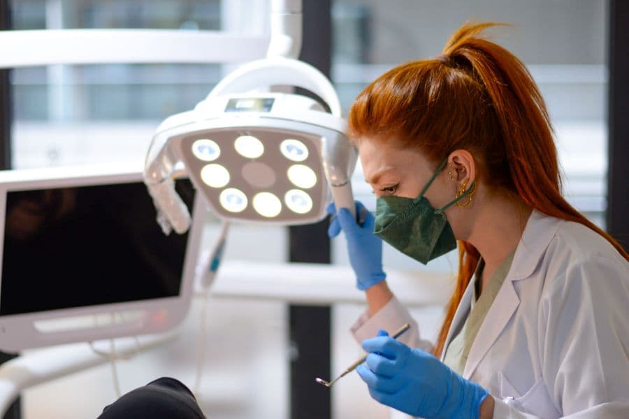 A dentist giving a patient a gentle check-up